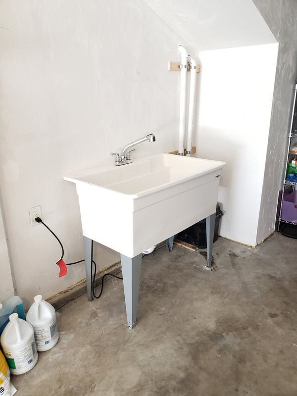 Large utility sink and faucet with tank and pump installation after