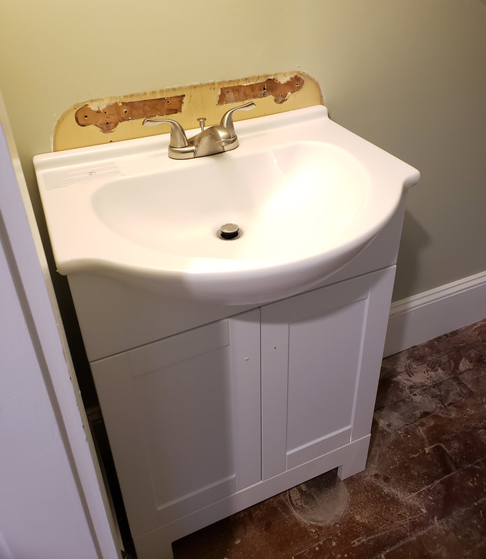 New vanity installation after removal of old wall hung sink