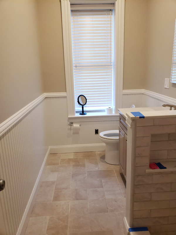 Open Meadows bathroom renovation after vanity  and toilet install