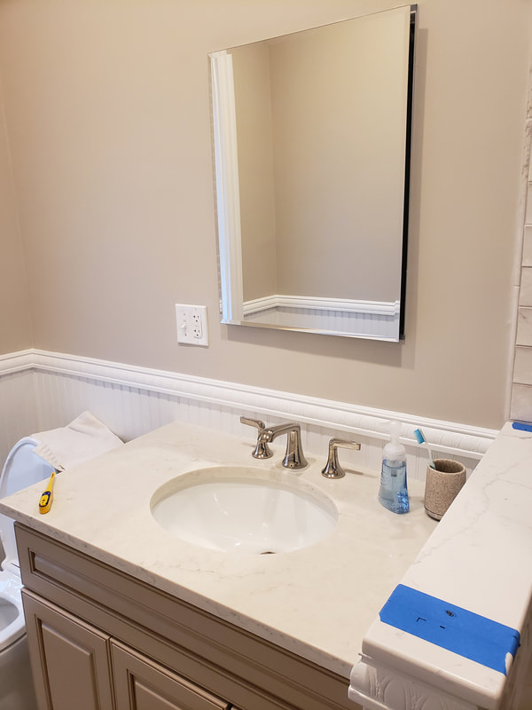 Open Meadows bathroom renovation after vanity  and toilet install
